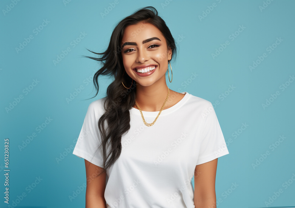 Portrait of a smiling asian woman with white tshirt. blue background Portrait of a smiling asian woman with white tshirt. blue background
