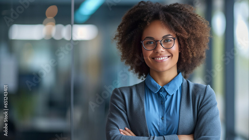 Happy african american young woman standing with arms crossed in office.generative ai