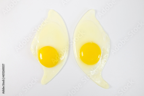 two fried eggs isolated on a white background photo