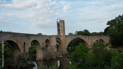 View of the medieval village  the bridge and the river of Besal   in Catalonia  Spain .