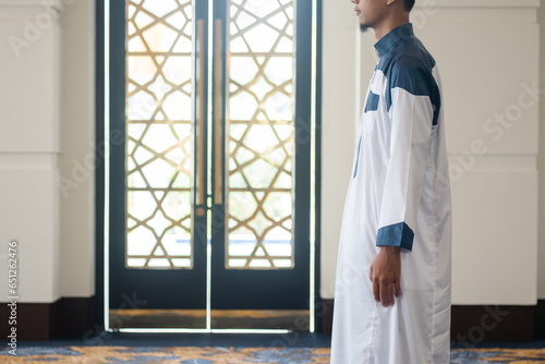 Asian muslim man solat and takbir take his hands up. Islam praying