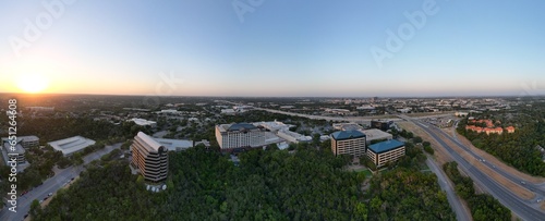 Sunset over the city and hill country. Clear blue skies. Orange sun. Vistas and panoramas.