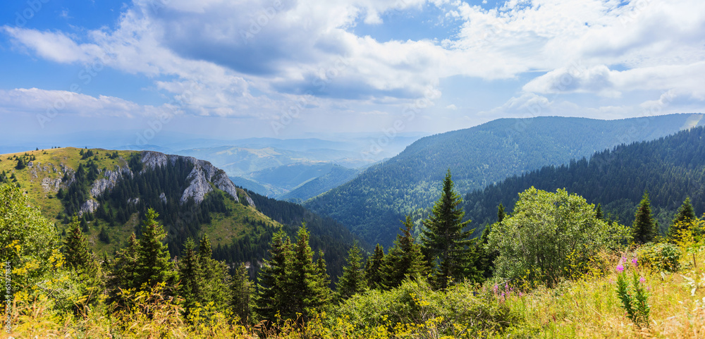 Summer nature mountains landscape. Scenery of green hills and fields. Beautiful blue sky with clouds. Panoramic view of Mountain Kopaonik, Serbia, Europe.