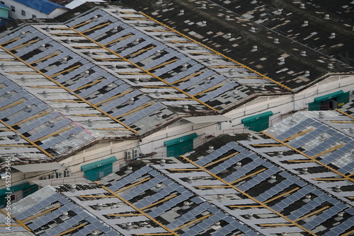 High-angle view of a large residential housing estate with organized streets and buildings.
