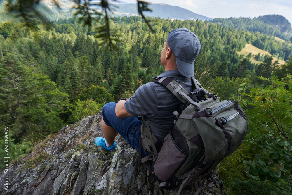 Hiker man on top of the mountains Hiker man on top of the mountains