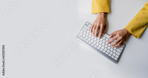 Close-up portrait typing keyboard on laptop computer. Working online on white table at office. Facebook chat. Website meeting. Blogger. Journalist writing articles. online job ideas