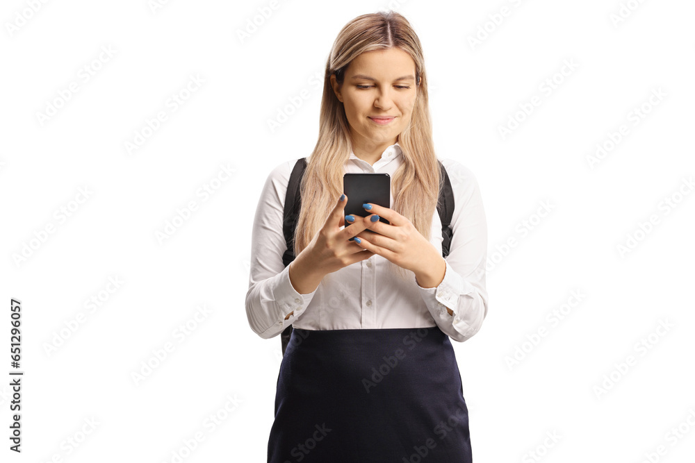 Schoolgirl holding a smartphone and typing Schoolgirl holding a smartphone and typing