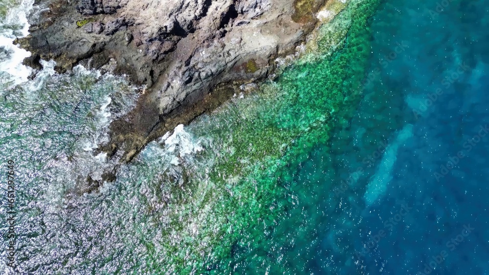 Big atlantic ocean waves meet the rocky coasts of the Canary Island of Tenerife