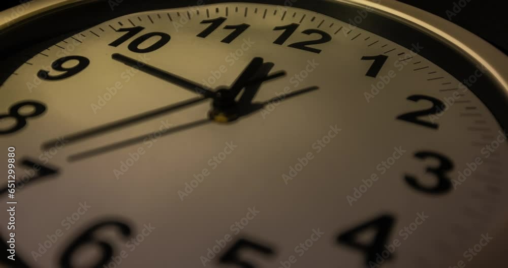 Clock face time lapse on white background with copy space for your own text. Clock time ticking on a classic Wall Clock. Shadows moving over the Watch. Half of a Clock dial close-up isolated. Concept Clock face time lapse on white background with copy space for your own text. Clock time ticking on a classic Wall Clock. Shadows moving over the Watch. Half of a Clock dial close-up isolated. Concept