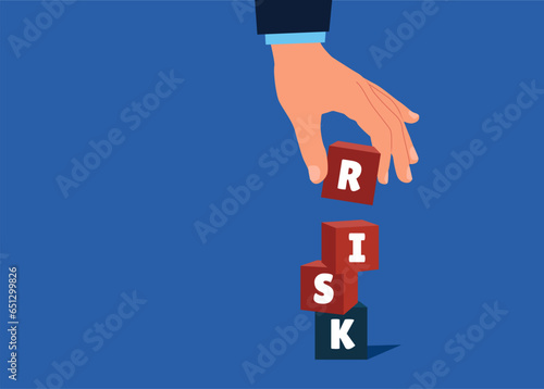 Hand businessman collects  pyramid of cubic stack with the word RISK. Solving problem, secure earning and loss. Flat vector illustration