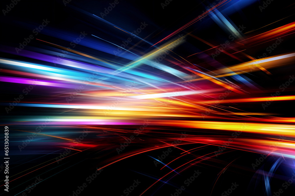 Abstract image of bright colored light streaks of red, orange and blue in motion on a black background