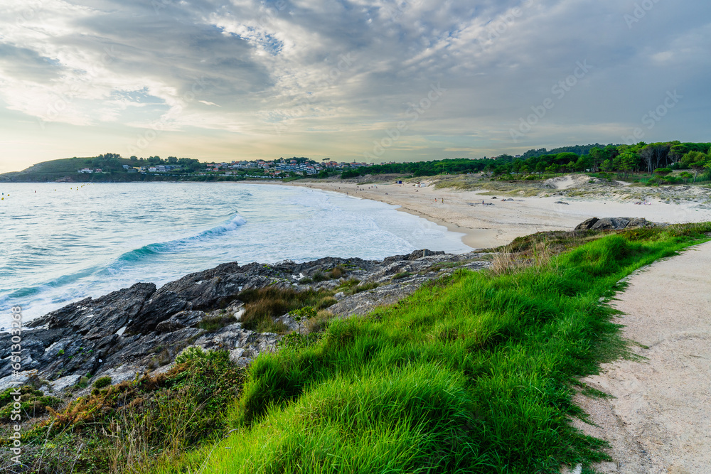 At the end, Montalvo Beach in the municipality of Sanxenxo in the province of Pontevedra, in Galicia, Spain.