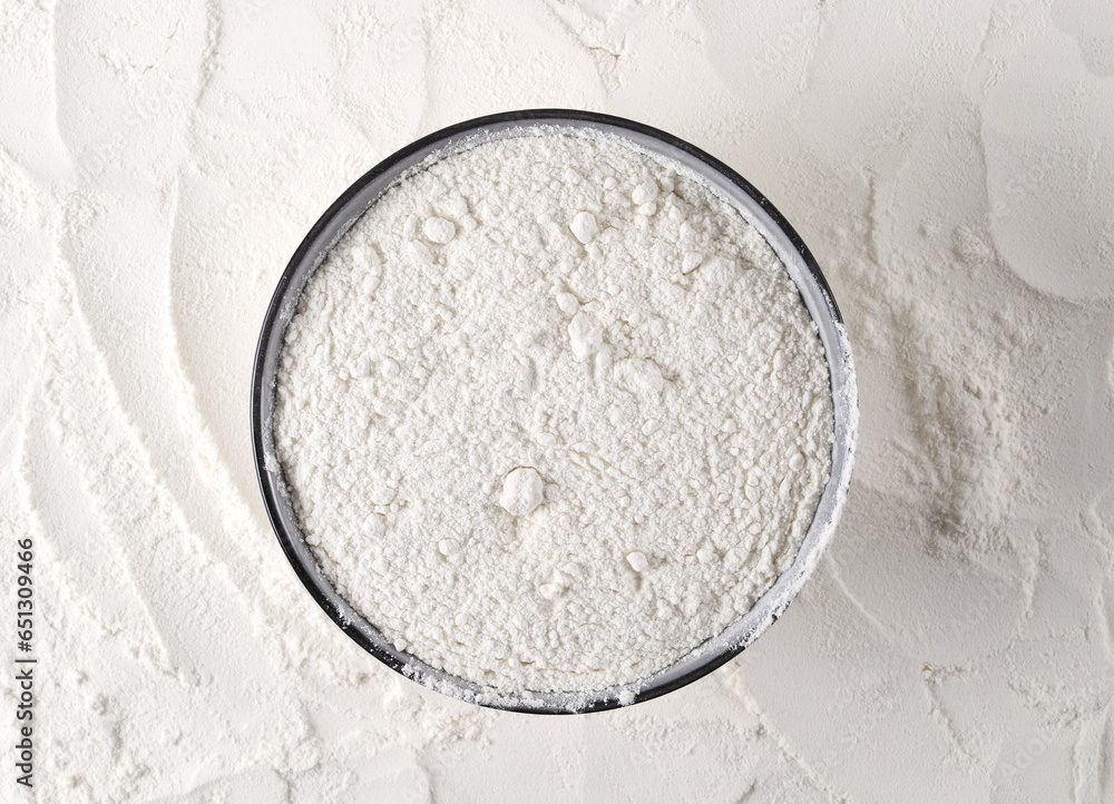 Wheat flour in bowl, top view Wheat flour in bowl, top view
