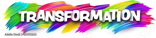 Transformation paper word sign with colorful spectrum paint brush strokes over white.