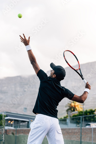 Side view of professional tennis player practicing outdoors © Artem Varnitsin