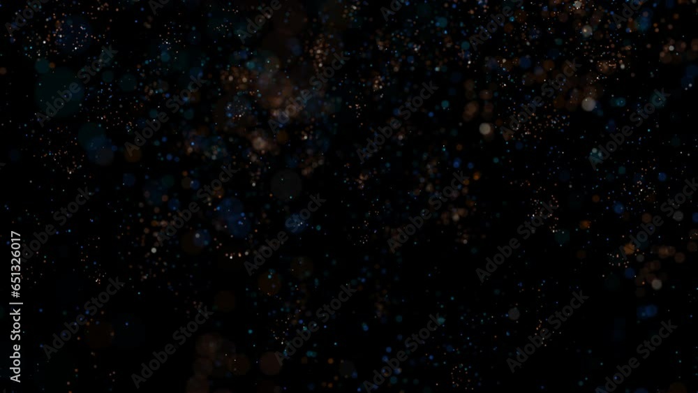 Brightly colored confetti in the form of particles elegantly descend, twirling in the air. An ideal festive background, also suitable for a vibrant and stylish presentation. Looped