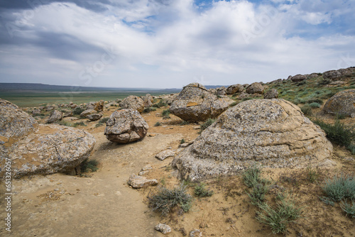 Unusual spherical shape of stones in the Kazakh steppe Mangistau, valley of balls in nature Torysh