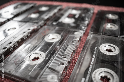 Retro Audio Nostalgia: Close-Up Shot of Colorful Cassettes on Red