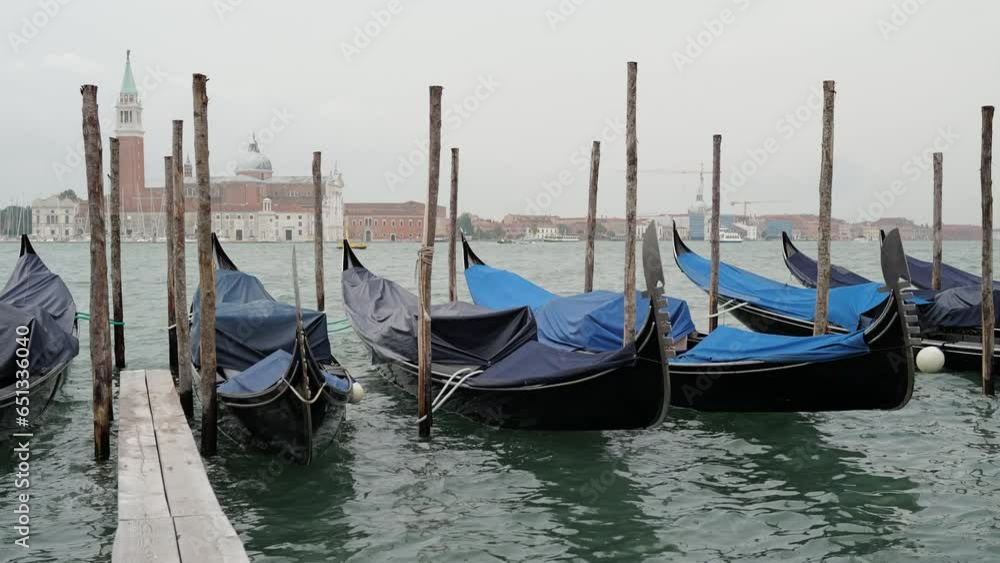 Venice, Italy - Gondolas and gondoliers in the San Marco basin and in the canals of the historic center under the Bridge of Sighs Venice, Italy - Gondolas and gondoliers in the San Marco basin and in the canals of the historic center under the Bridge of Sighs