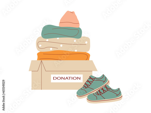 Clothes donation. Cardboard box full of different clothes. Charity, things donation for needy and poor people. Concept of volunteering and social assistance. International Day of Charity. Flat vector.