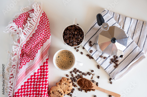 Coffee set of espresso boiler with grounded and beans of coffee on white background with arabick shmagh photo