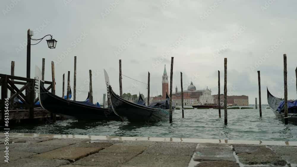 Venice, Italy - Gondolas and gondoliers in the San Marco basin and in the canals of the historic center under the Bridge of Sighs Venice, Italy - Gondolas and gondoliers in the San Marco basin and in the canals of the historic center under the Bridge of Sighs