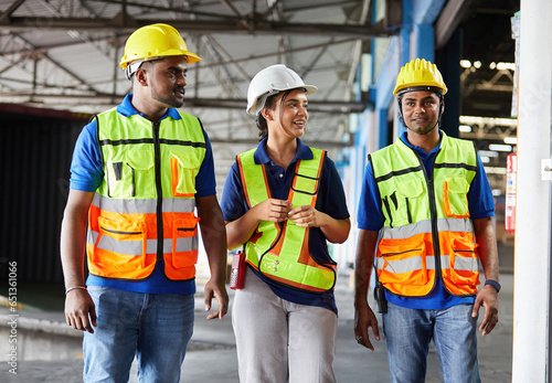 factory workers walking and talking about work or project in the warehouse storage