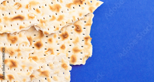 Pieces of Matzah Bread Unleavened Bread on a Blue Background photo