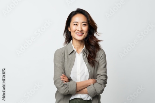Medium shot portrait photography of a Vietnamese woman in her 30s against a white background