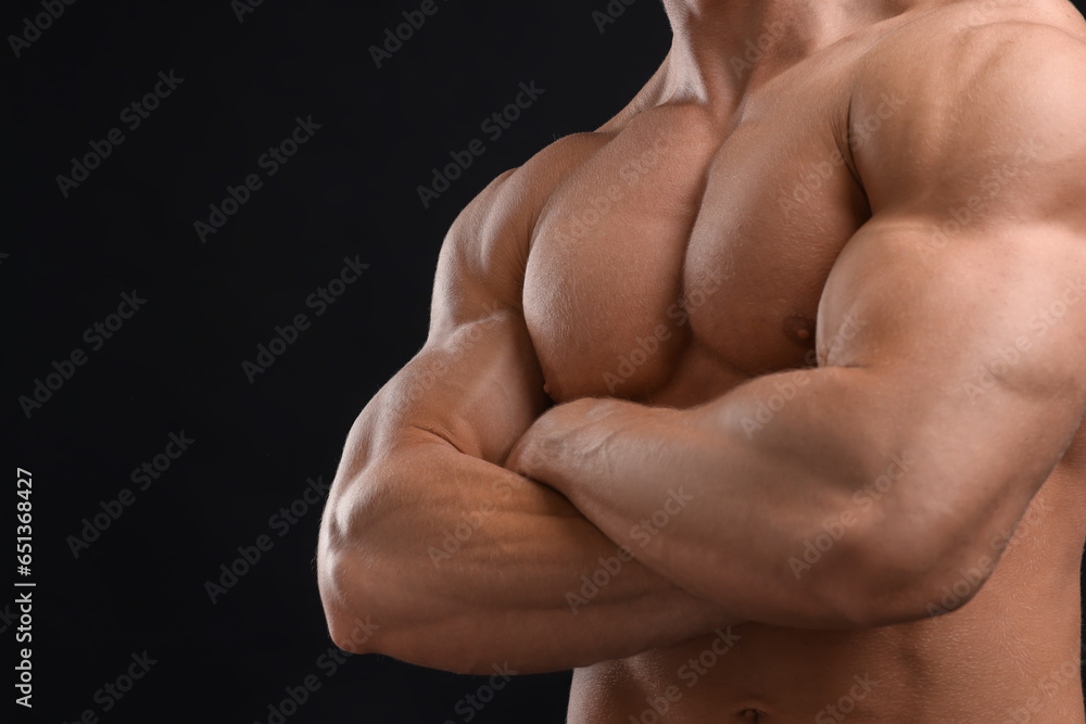 Muscular man on black background, closeup and space for text. Sexy body Muscular man on black background, closeup and space for text. Sexy body