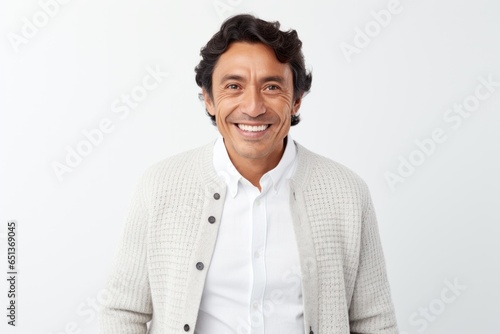 Lifestyle portrait photography of a Peruvian man in his 40s against a white background