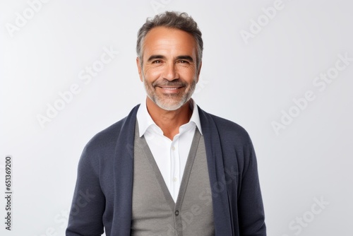 Lifestyle portrait photography of a Peruvian man in his 50s against a white background