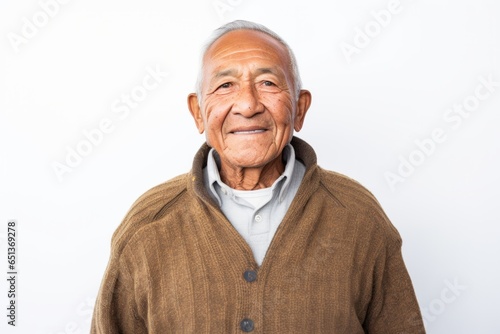 Medium shot portrait photography of a happy Peruvian man in his 70s against a white background