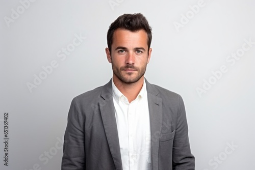 Medium shot portrait photography of a tender French man in his 30s against a white background