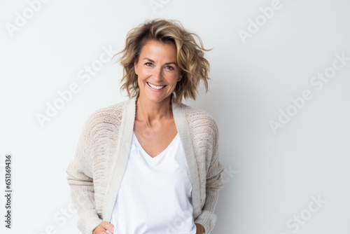 Portrait photography of a cheerful French woman in her 40s against a white background