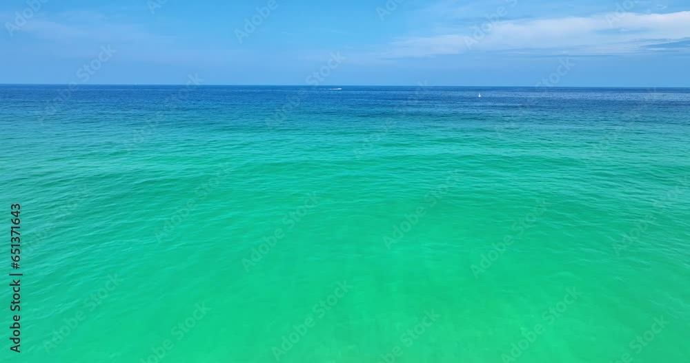 Aerial view of beautiful sea water background in summer day and sun reflections,Aerial flying drone view ocean background, Waves water surface,Flight over the ocean,Top view fly over the sea Aerial view of beautiful sea water background in summer day and sun reflections,Aerial flying drone view ocean background, Waves water surface,Flight over the ocean,Top view fly over the sea