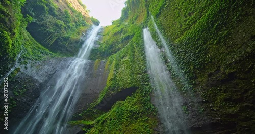 Amazing Beautiful Madakaripura waterfall in tropical rainforest in national park at East Java, Indonesia, Bottom view waterfall landscape for Travel background
