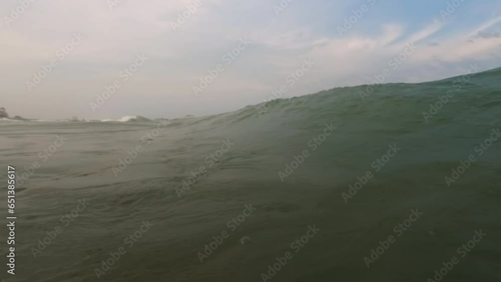 Big Wave splashing on sunny day, Water Foam, . Slow mo Wide shot footage Big Wave splashing on sunny day, Water Foam, . Slow mo Wide shot footage