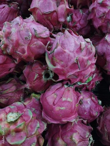 Close-up photo of a pile of dragon fruit (Selenicereus undatus) in a supermarket, ready to be sold to meet your daily needs