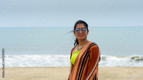 Young indian woman happy in the beach