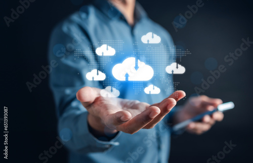 Businessman using smart phone cloud computing to download and loading data information and upload on system network application. Technology transformation
