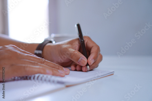 Author Hand Holding Pen Write in Notebook, Writing Journal Concept 
