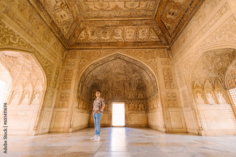tourists and  the architectural wall of Agra Fort, India  - obrazy, fototapety, plakaty 