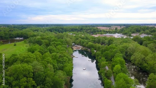 Aerial Panning Shot Of Pond Amidst Green Trees And Plants Against Sky - Crawfordsville, Indiana photo