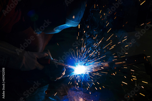 horizontal view of welder working