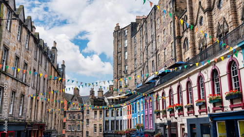 Victoria Street with its medieval houses and shops with brightly colored facades, Edinburgh, Scotland. photo