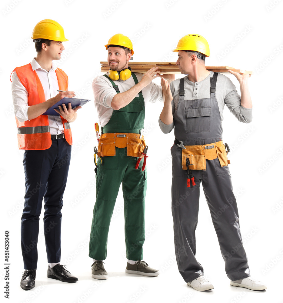 Team of male builders with wooden planks on white background Team of male builders with wooden planks on white background