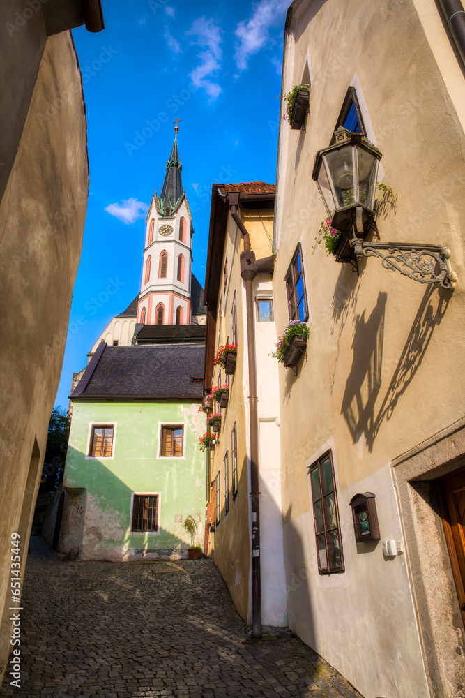 Narrow, Cobbled Street in Cesky Krumlov, Czech Republic, with the Saint Vitus Church in the Background