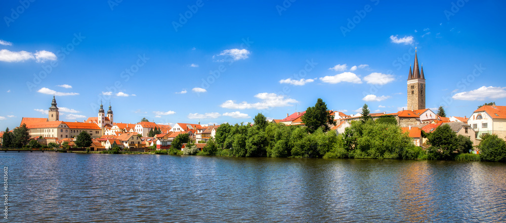 Obraz na płótnie Panoramic View of Beautiful Telc at the Lake Ulicky Rybnik in the Czech Republic, with Towers of the Name of Jesus Church, the Church of St James, and the Church of the Holy Spirit w salonie