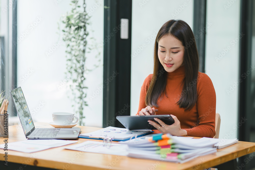 Financial analyst or accountant analyze business financial reports on a digital laptop to planning investment project. Financial analyst or accountant analyze business financial reports on a digital laptop to planning investment project.